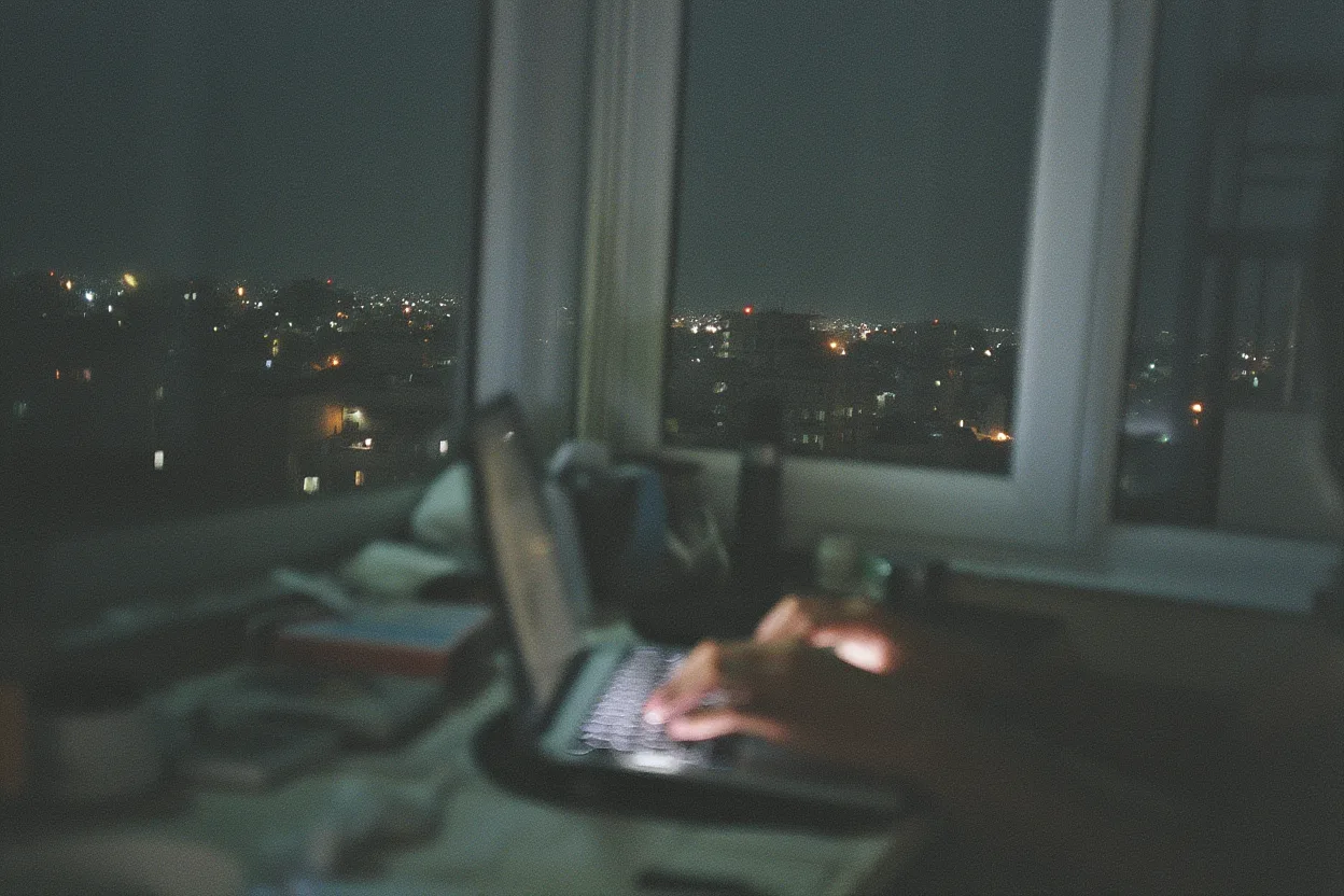 Night desk scene overlooking city lights
